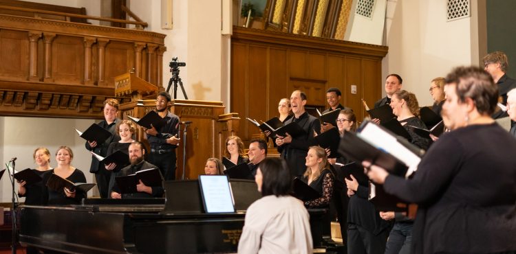 Bel Canto members laugh during a pause in dress rehearsal