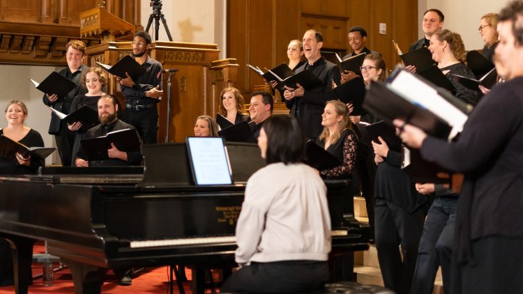 Bel Canto Company laughing as they warm up for a concert at First Presbyterian Church in 2023