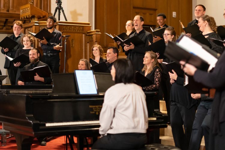 Bel Canto Company laughing as they warm up for a concert at First Presbyterian Church in 2023