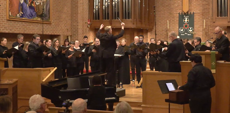 Welborn Young conducts Bel Canto Company at Ebenezer Lutheran Church in 2023 as the audience looks on in the foreground