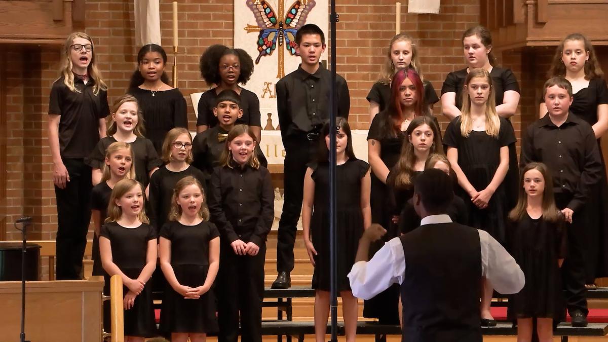 LJ Martin conducting the Greensboro Youth Chorus, performing at their Spring concert